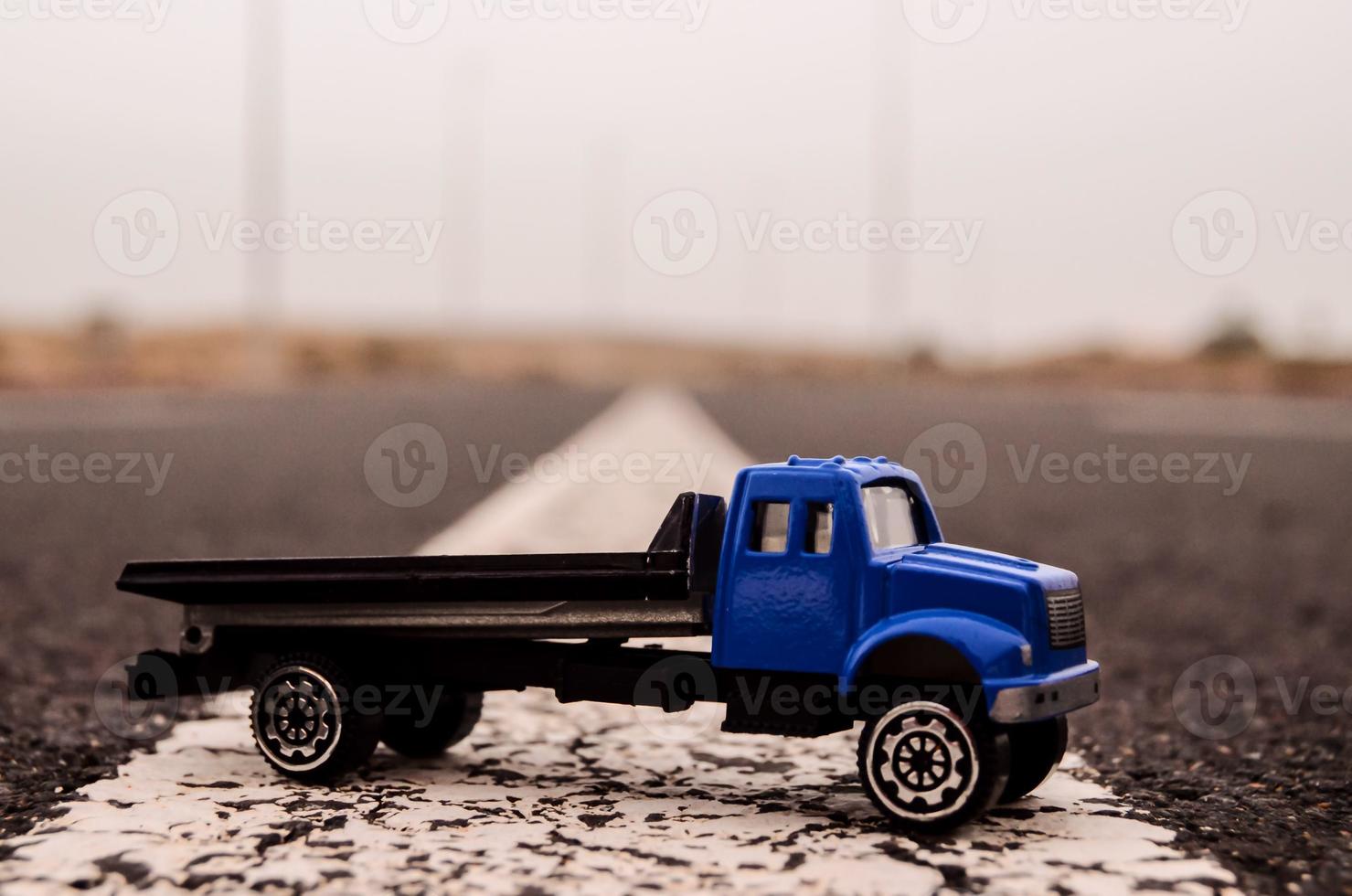 Toy truck on the road photo