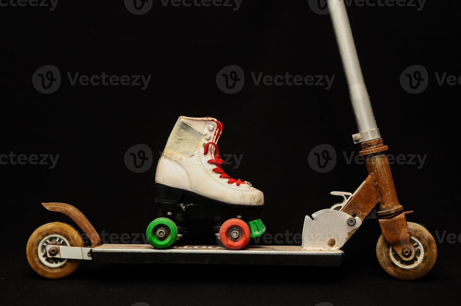Roller skater on a scooter photo