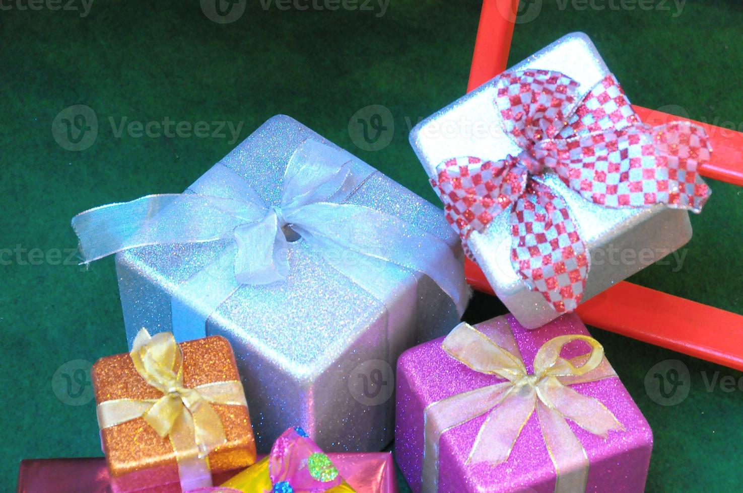 Gift boxes on green background photo