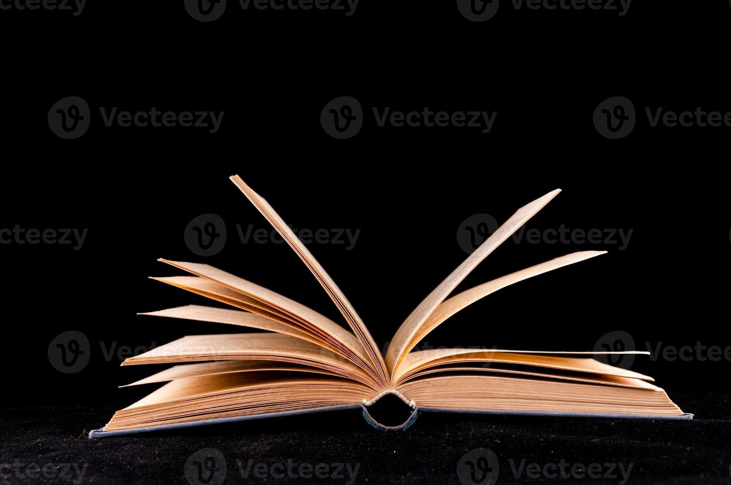 Book on black background photo