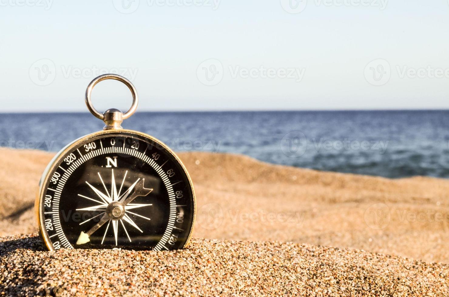 Compass at the beach photo