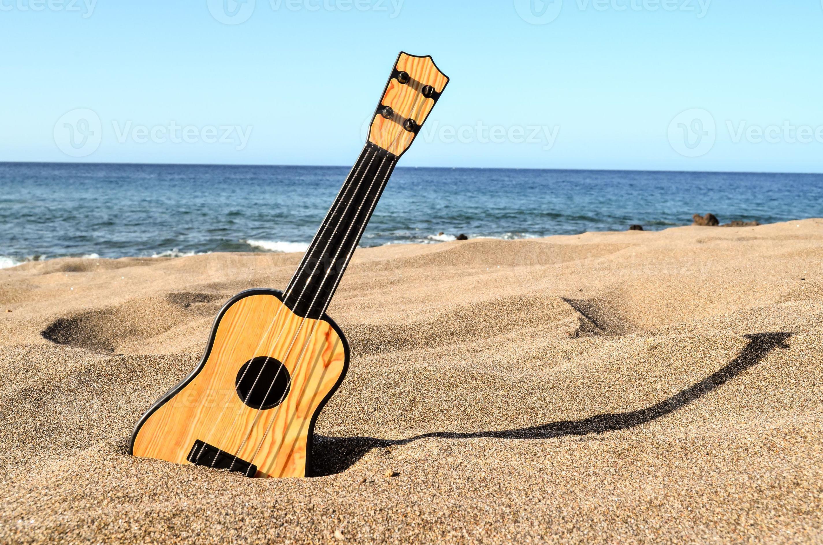 Ukulele the beach 19563480 Stock at Vecteezy