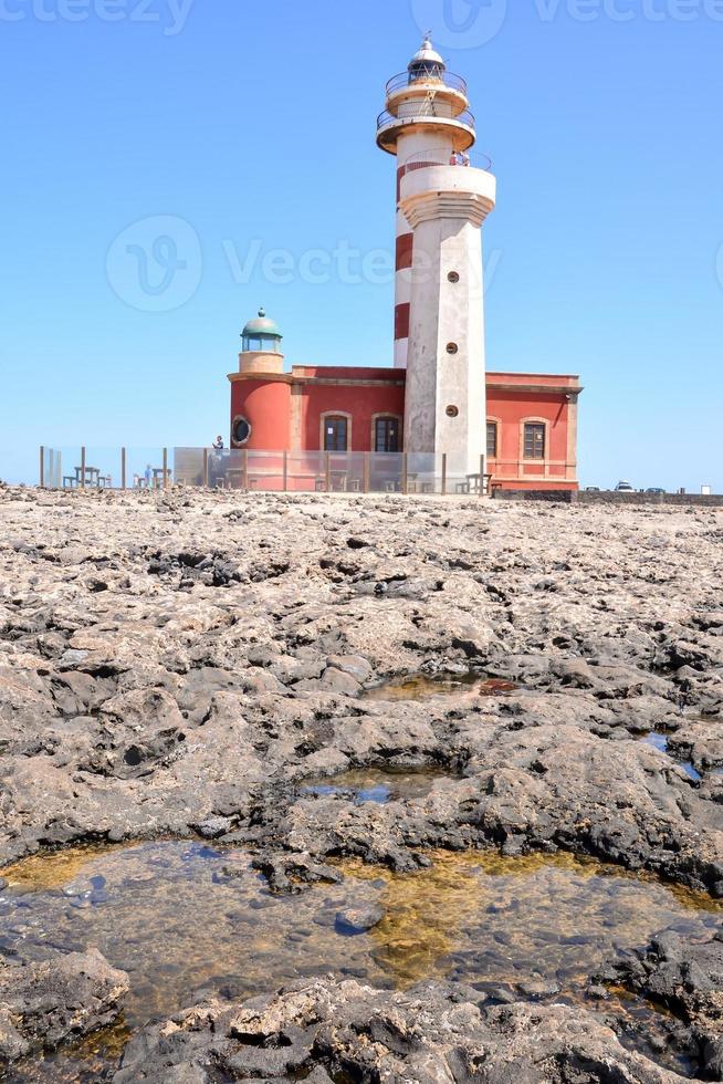 Lighthouse by the sea photo