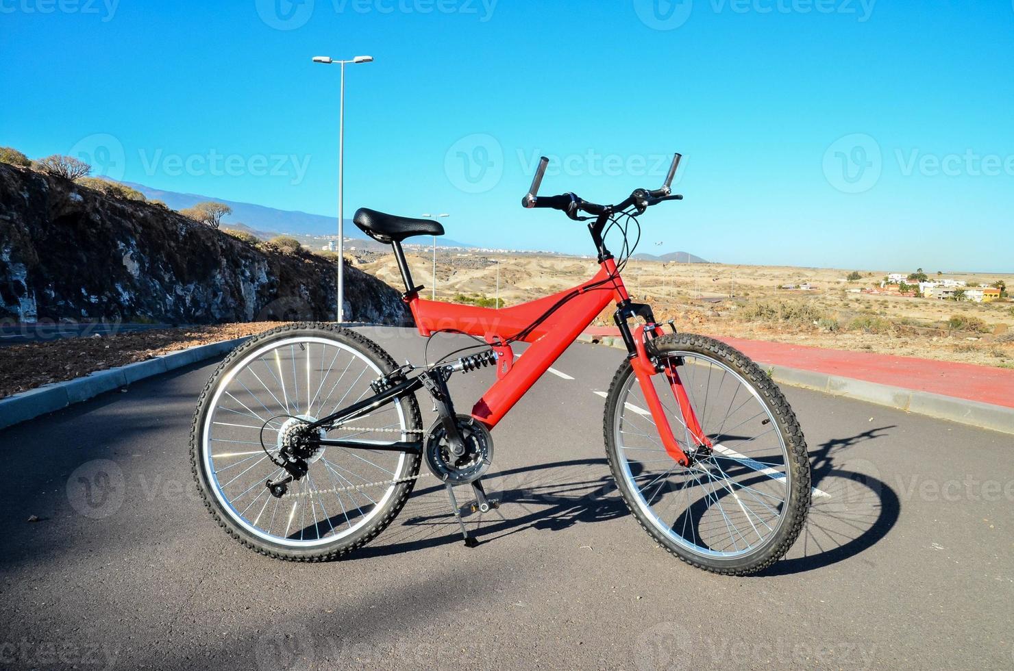 Red bicycle on the road photo