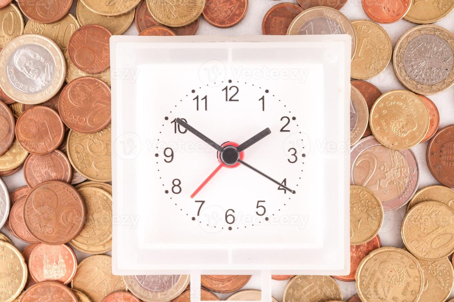 reloj en monedas foto