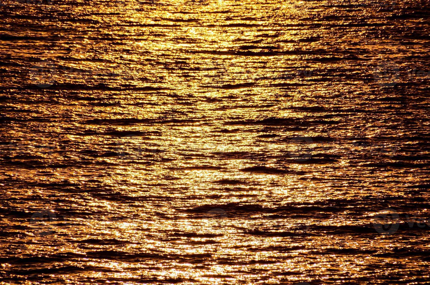 Sunset by the sea photo