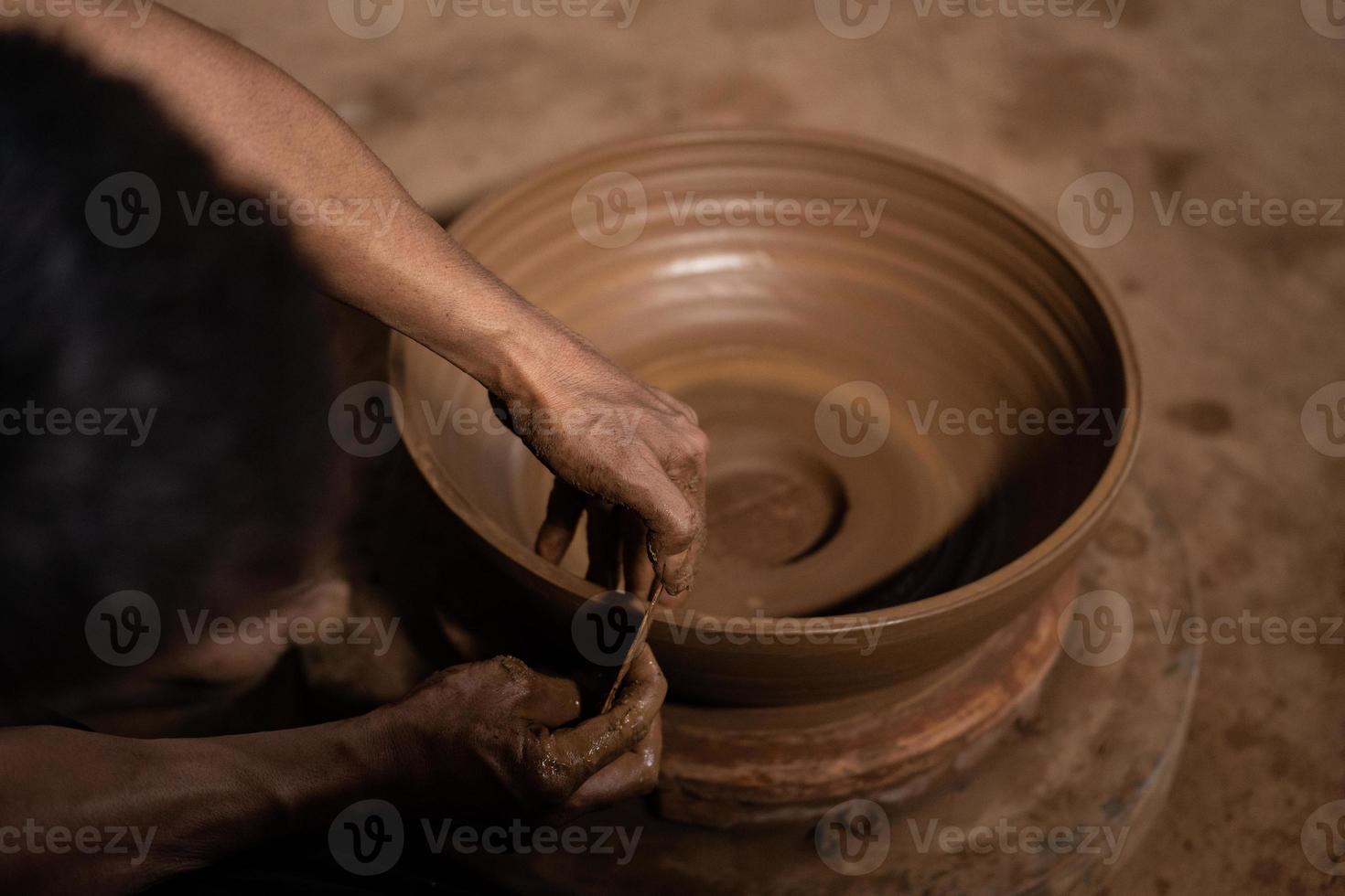 The process of forming traditional pottery crafts, located in Kasongan, Yogyakarta, Indonesia photo