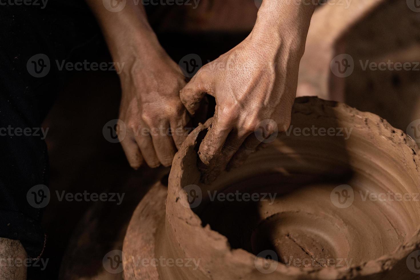 The process of forming traditional pottery crafts, located in Kasongan, Yogyakarta, Indonesia photo