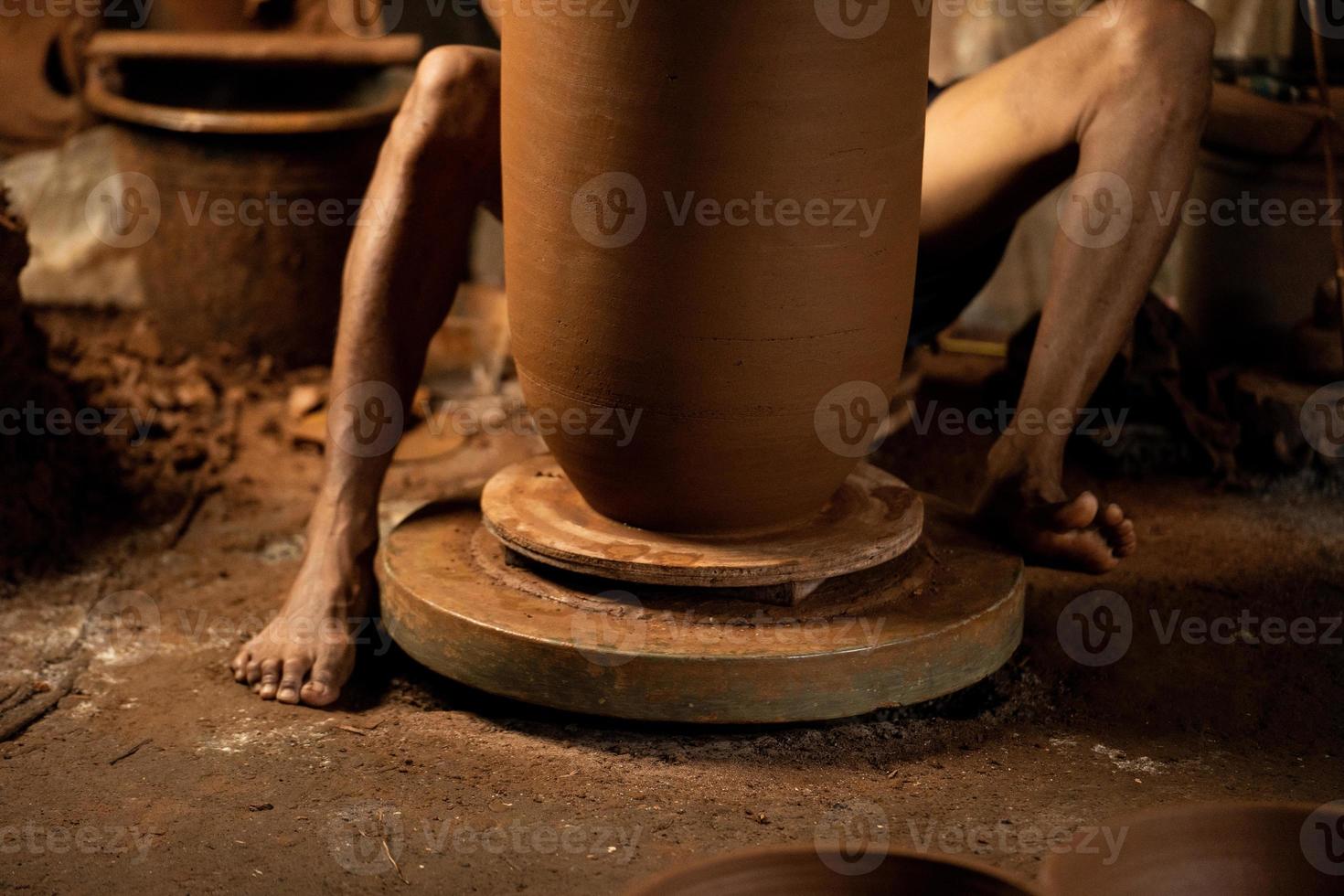 The process of forming traditional pottery crafts, located in Kasongan, Yogyakarta, Indonesia photo