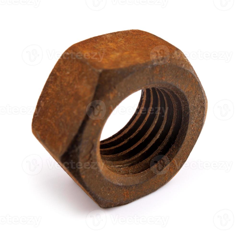 Old rusty nut isolated on white background. Full clipping path. photo