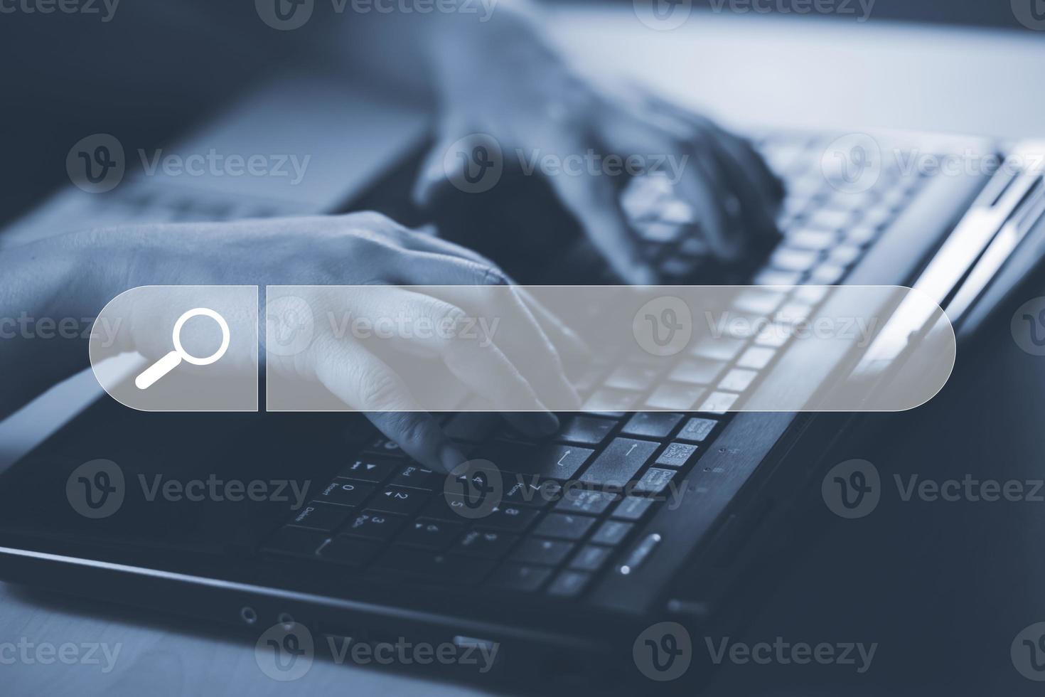 Searching Browsing Internet Data Information with blank search bar. man's hands are using a computer keyboard to Searching for information. Using Search Console with your website. photo