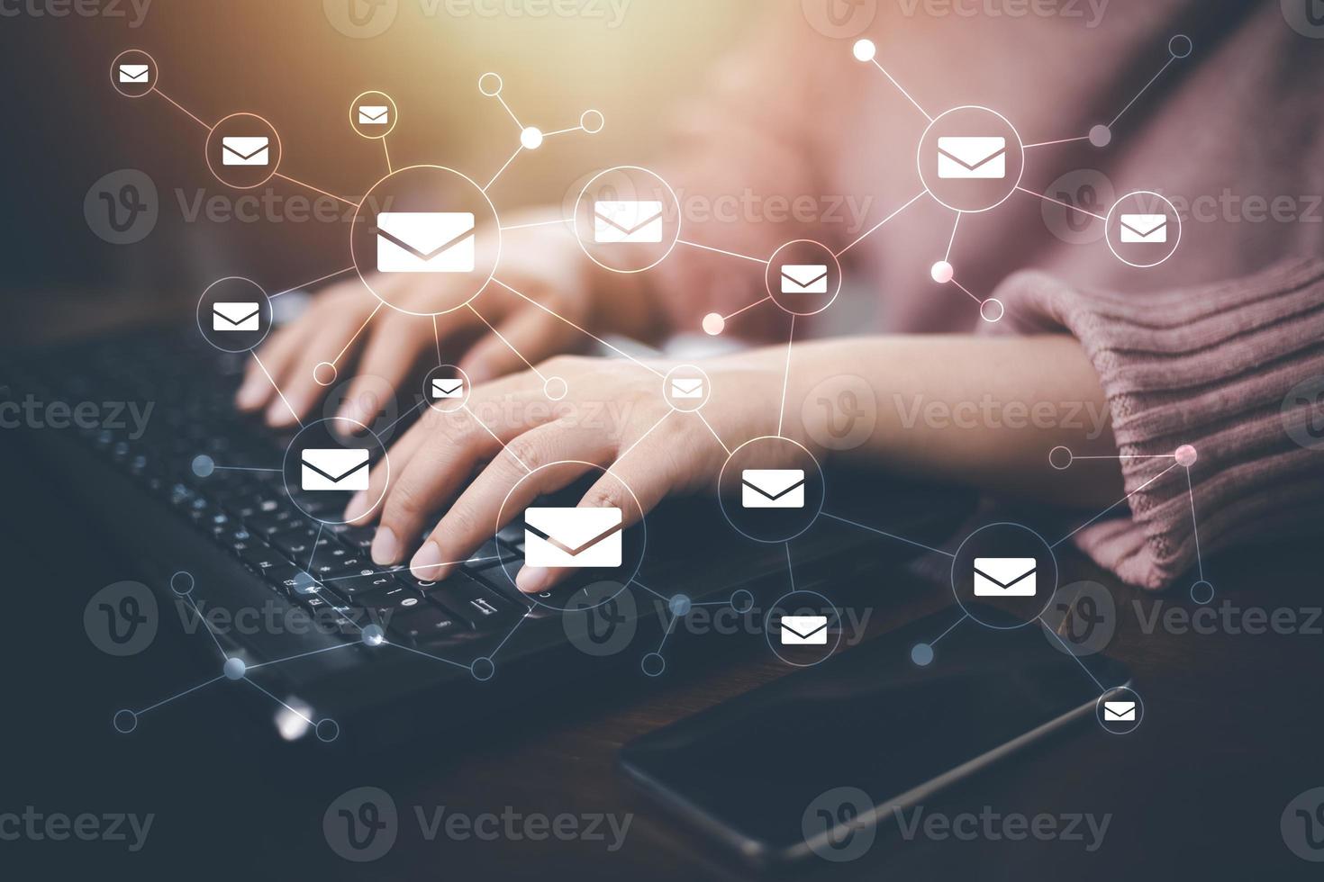 The email with the laptop, Businessman touching an email on a touch screen with his finger with keyboard for sending the e-mail from the laptop computer, Concept of sending emails from your computer, photo