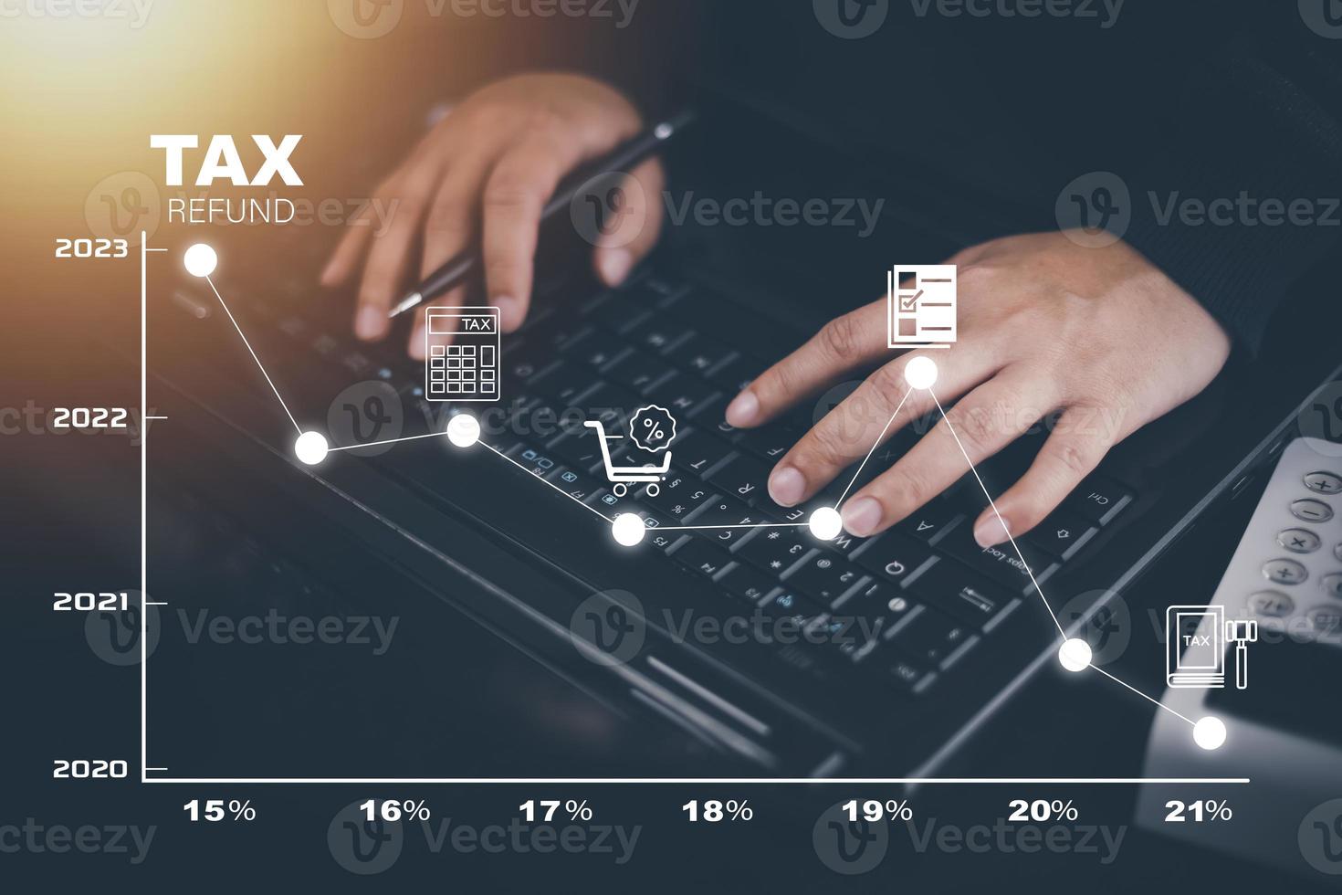 Concept of tax payment optimisation business finance,Man using calculator and taxes icon on technology screen,income tax and property, background for business, individuals and corporations such as VAT photo