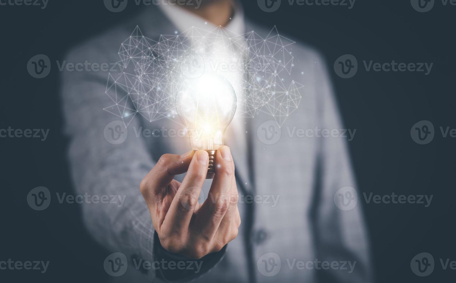 Creativity in the hands of business people idea concept, Businessman holding glowing light bulb with drawing brain and connection line, creative thinking ideas and innovation technology and creativity photo