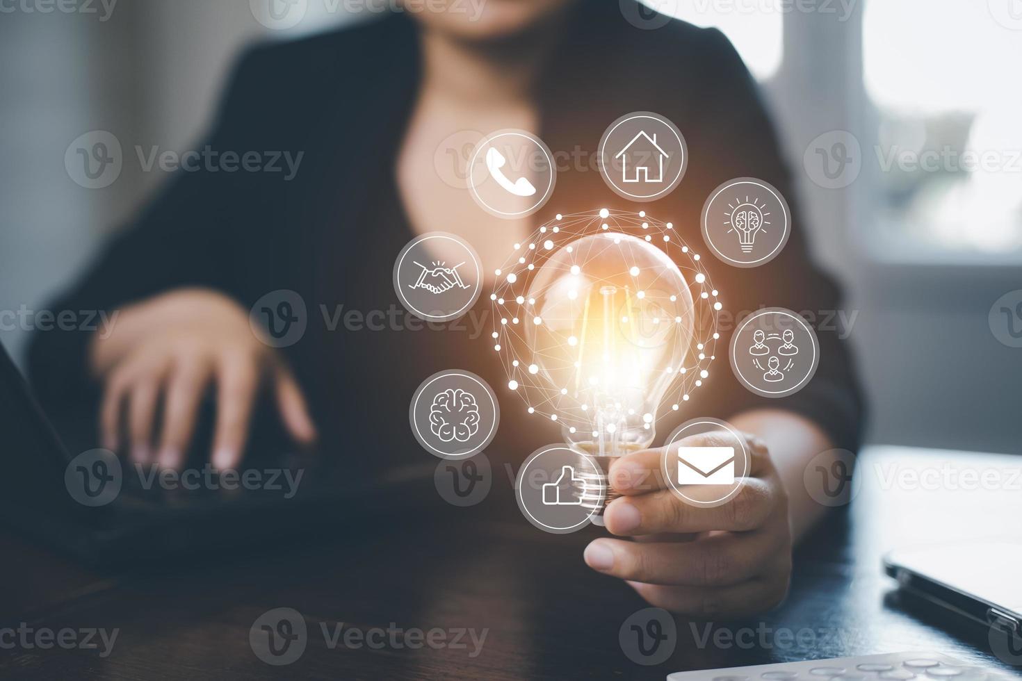 thinking and creative concept, Close up the light bulb and woman working on the desk, Creativity, and innovation are keys to success,  new idea and innovation with Brain and light bulbs,big data photo