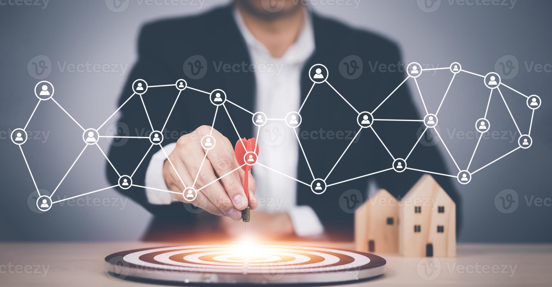 Targeting the business concept, Businessman hand holding red dart to the virtual target dartboard, Executive marketing, investment goal and target for business investment concept, photo