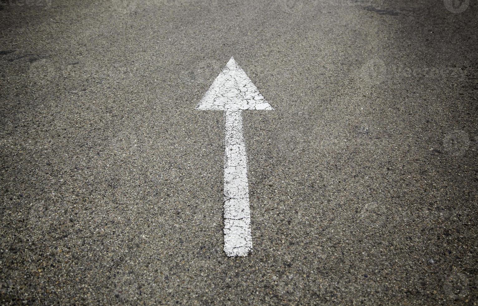 Direction arrow on the asphalt photo