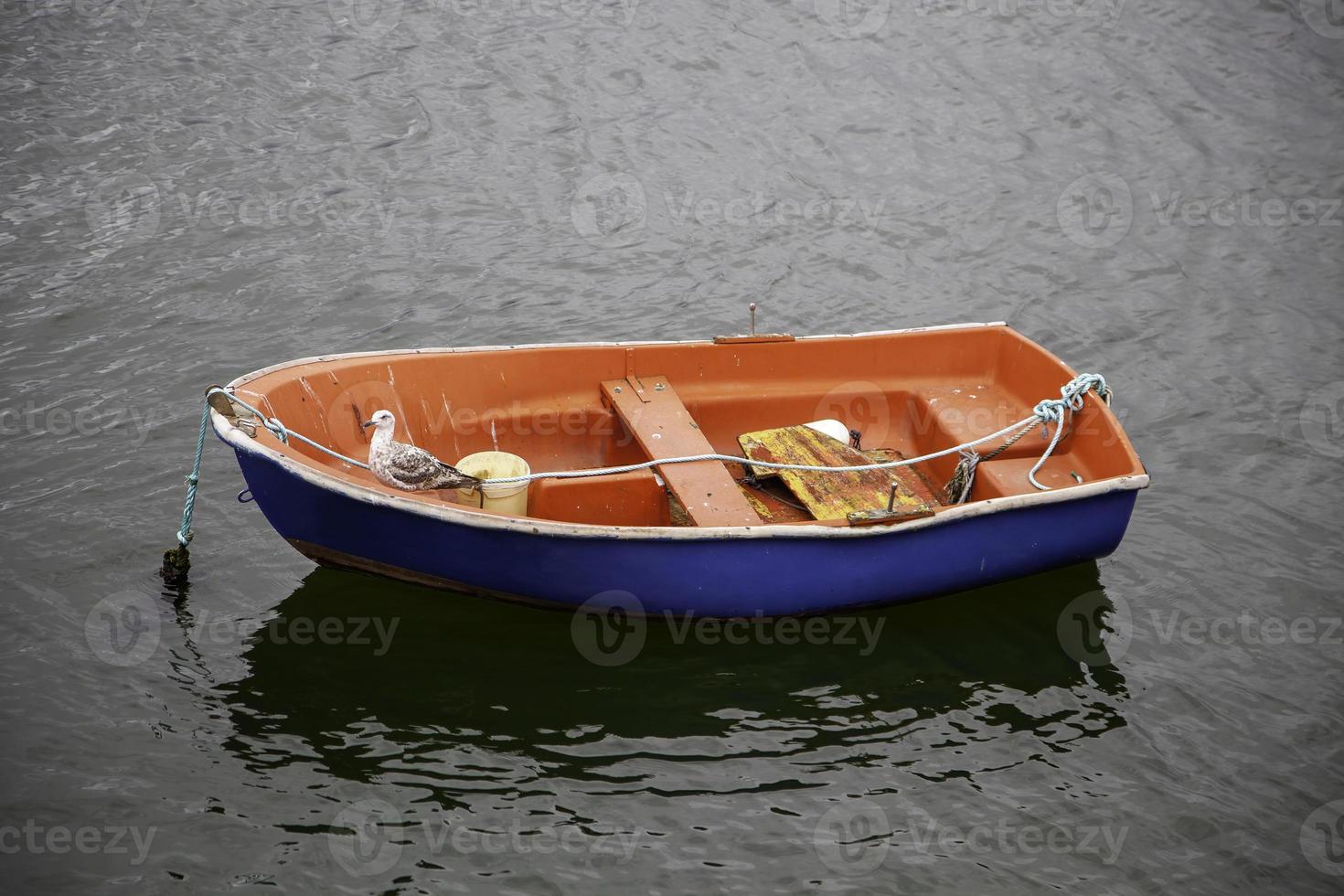 Small boat on the water photo