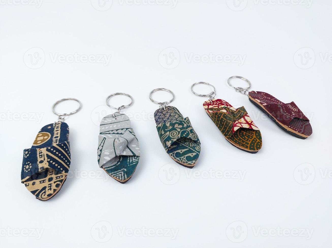 a miniature sandal with a batik motif on a white background photo