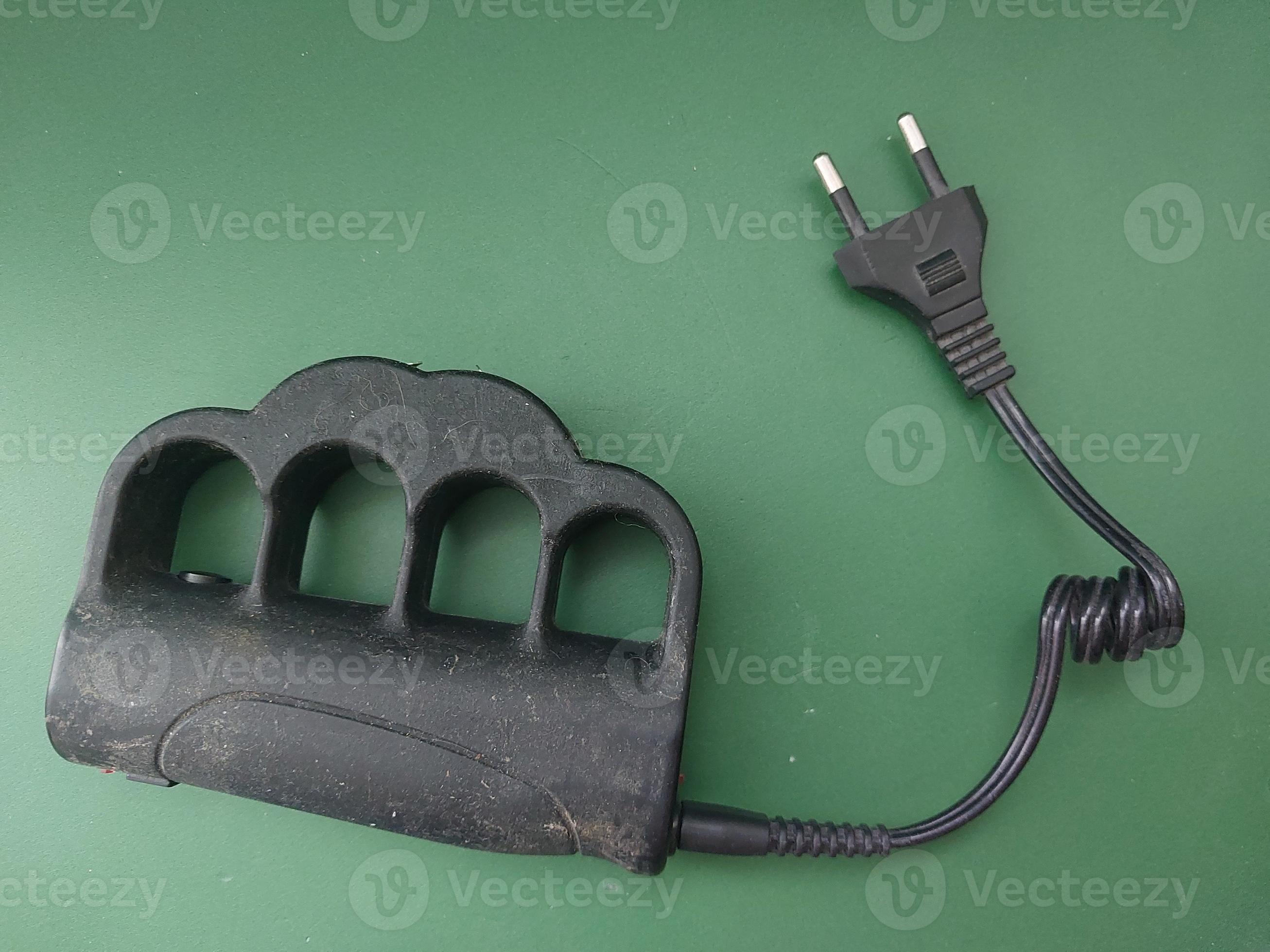 Taser brass knuckles for selfdefense and defense 19564763 Stock Photo