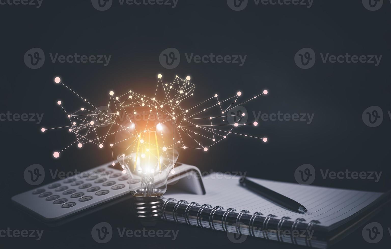 Thinking and creative concept, Light bulb on the Book and light bulb style bokeh vintage dark background,Concept The idea of reading books, knowledge, and searching for new ideas. photo
