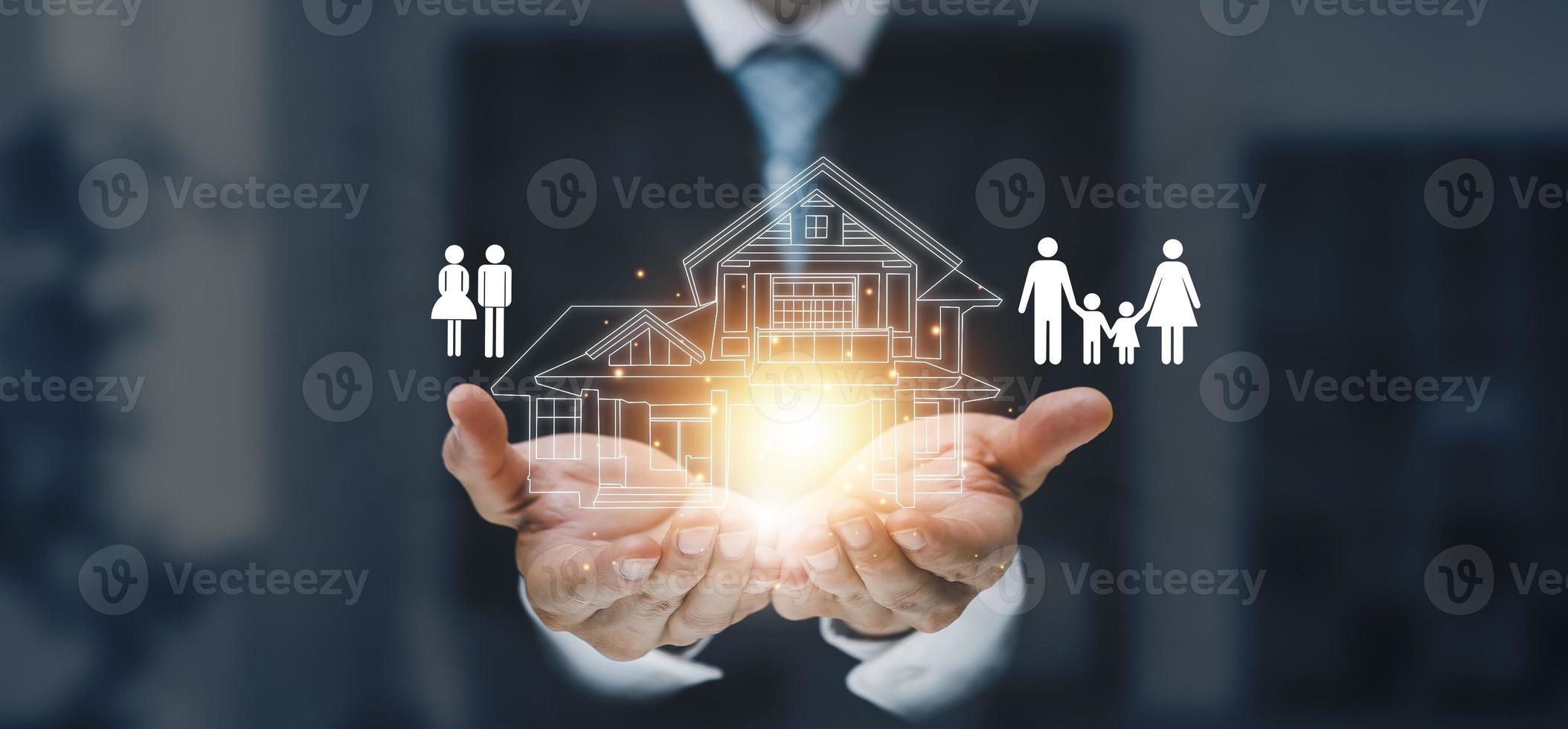 engineering and architecture drawings concept, Engineer man hold house on virtual screen of architect ,Insurance agent with model of house on light background,Property insurance and security concept. photo