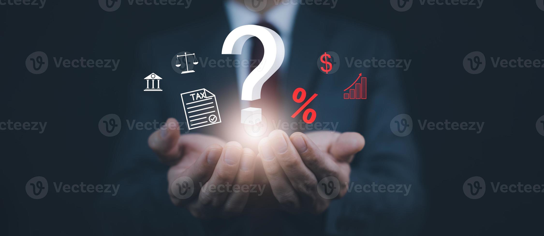 Tax with Ask question online concept, Businessman hold interface question marks tax payment optimization business finance, Concept of searching for an answer, Uncertainty, and problem-solving. photo