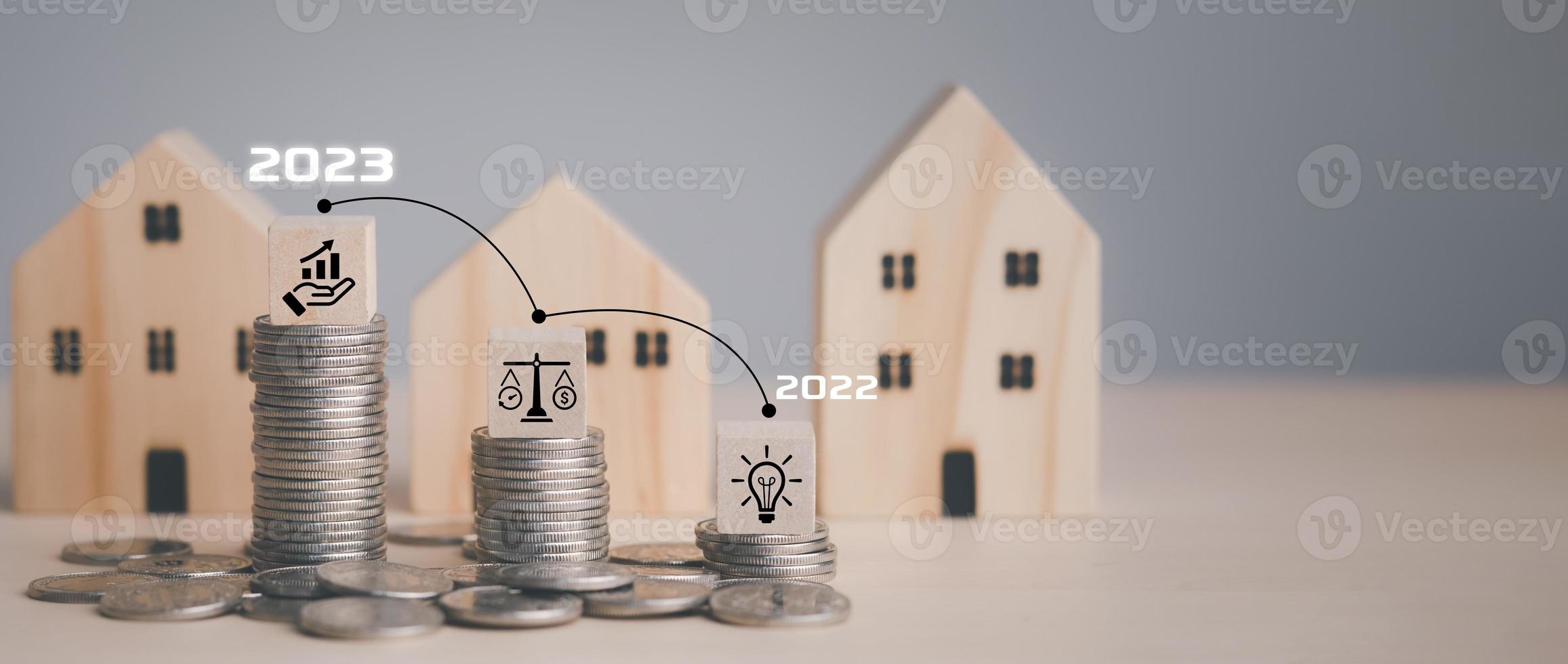 Wooden Home on coins stack in front a lot of coins, Save money concept, Property investment, house loan, reverse mortgage, gold coins money stack growth, saving money coins stack future for home photo