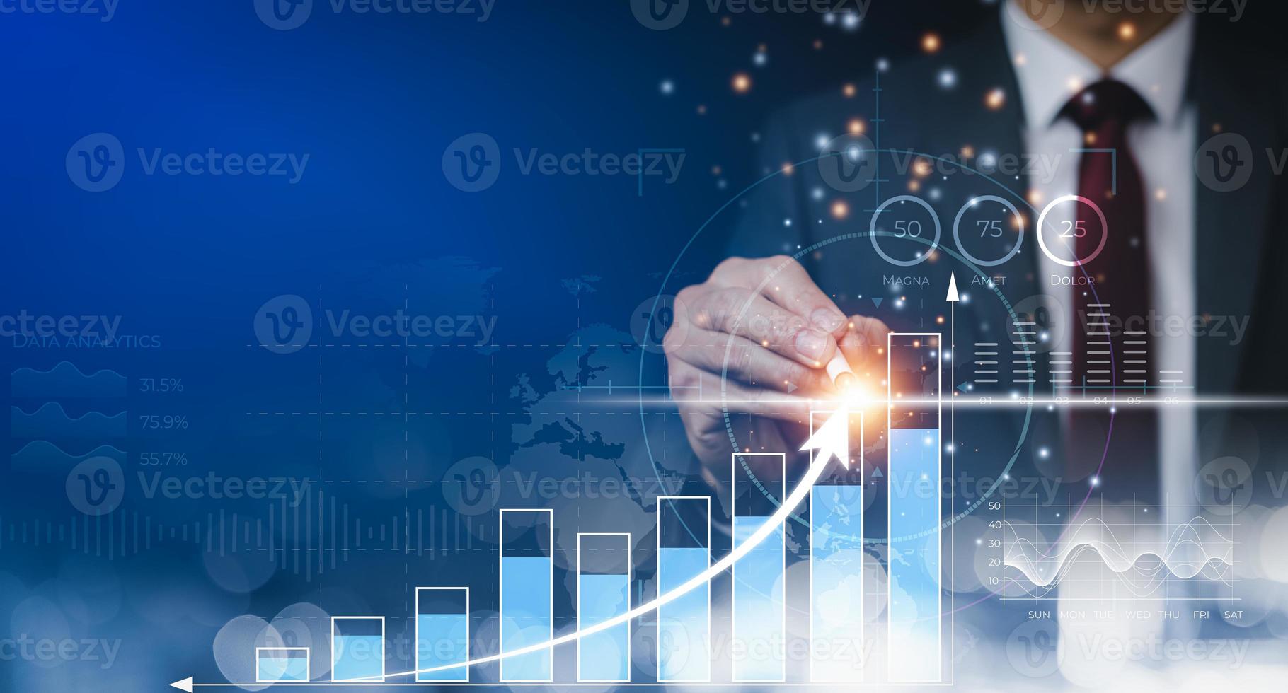Businessman using pen touch bar graph of analytics and financial, Changes in new planning, Business growth, ideas and perspectives, Stock investment, and dividends yield from business in the new year photo