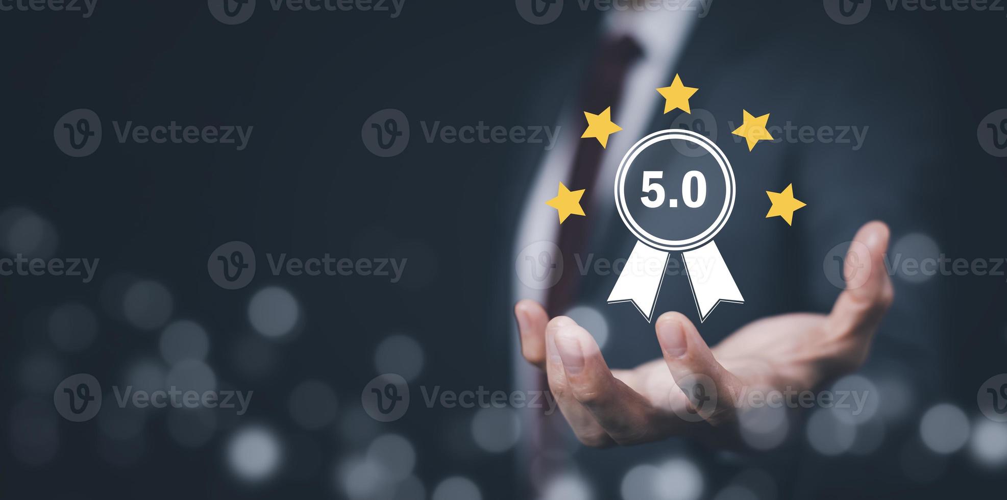 Quality assurance of business services, Businessman Hand shows the sign of the top service Quality assurance in Black background , Guarantee, Standards, ISO certification and standardization concept. photo