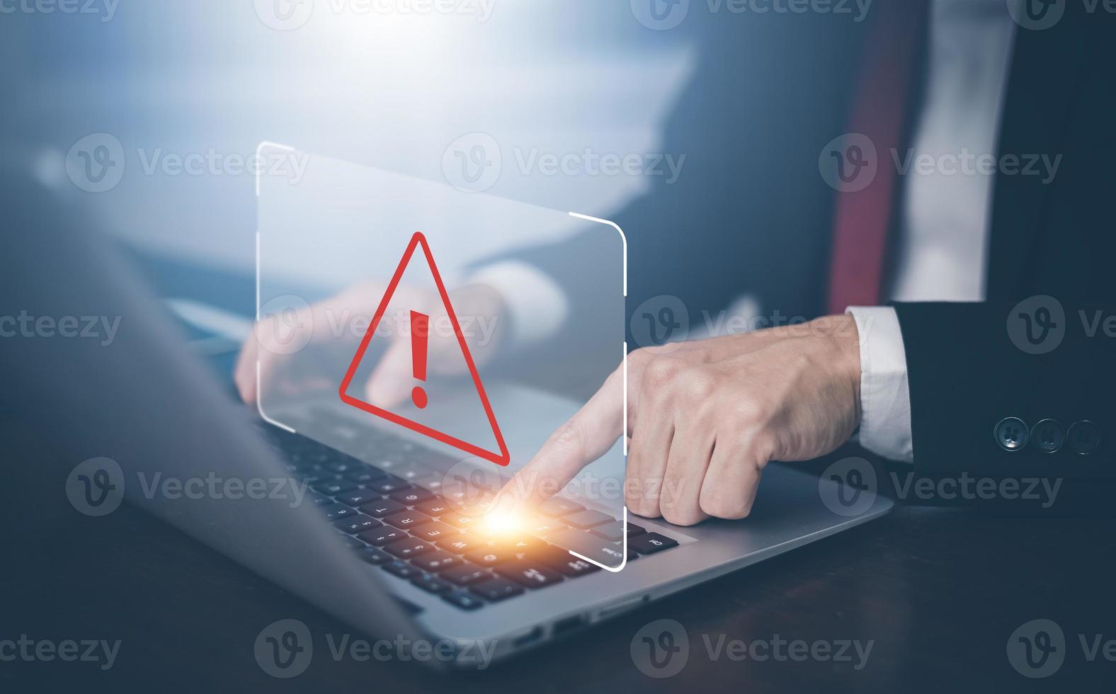 Email concept with laptop spam and virus computer monitor internet security concept,Businessman using laptop with triangle caution warning sign for notification error, Spam Email Pop-up Warning. photo
