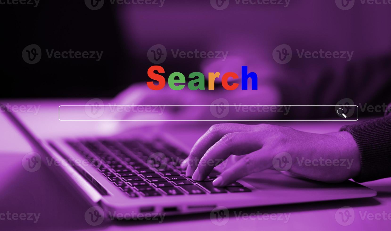 Hand type laptop and Searching Browsing Internet Data Information with blank search bar. man's hands are using smartphone and keyboard to Searching for information. Using Search Console with website. photo