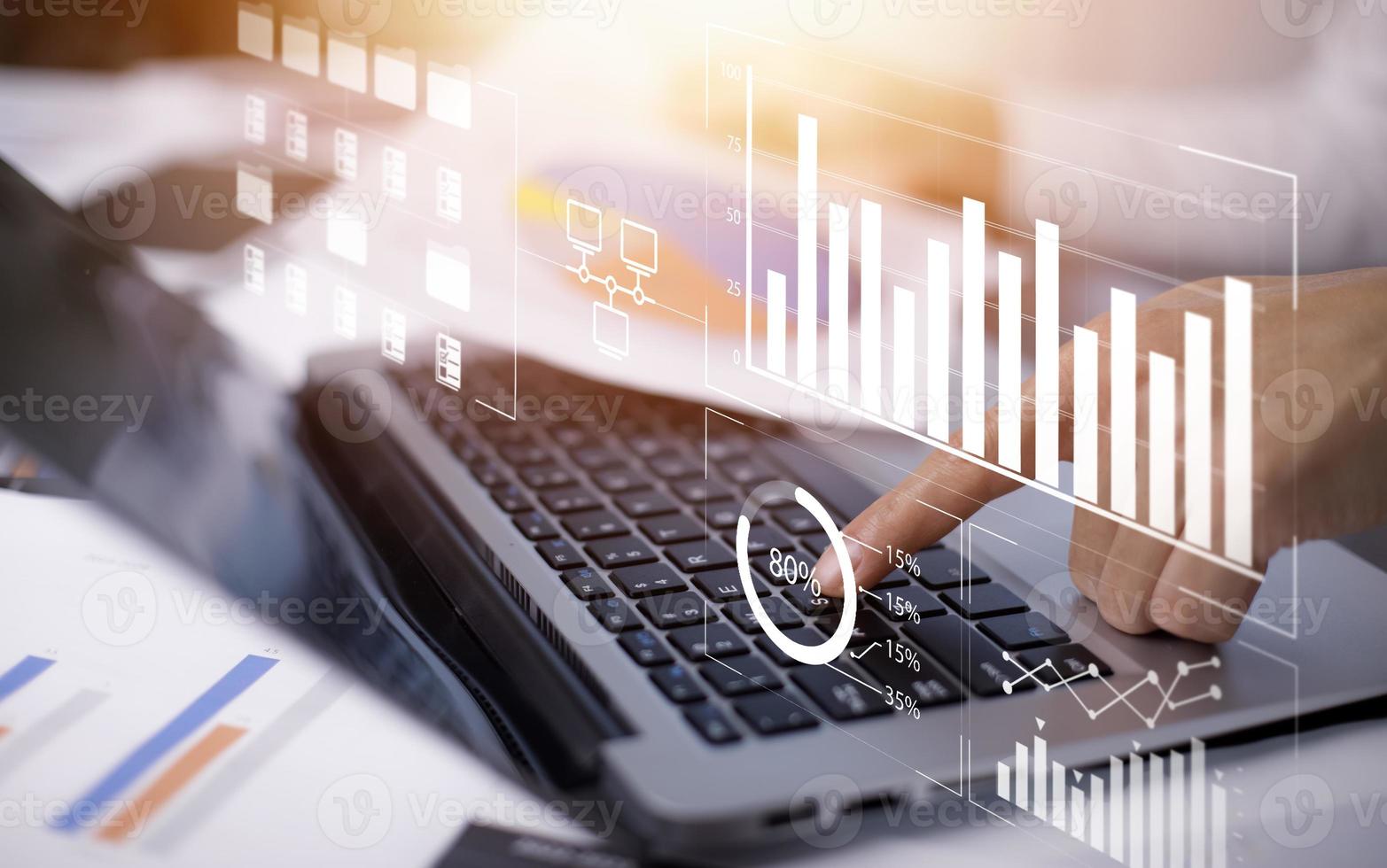 Businessman working on a laptop with Online documentation, Analyst working with Business Analytics and Data Management, Virtual Document Management System, Software for archiving corporate files. photo