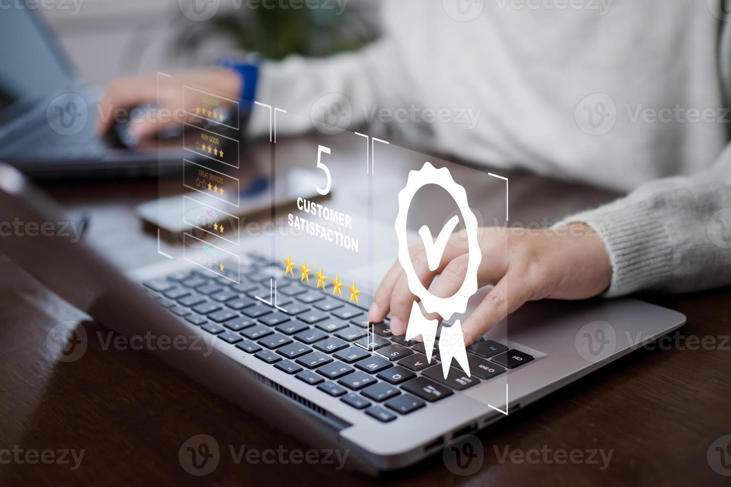 Quality assurance of business services, Woman using laptop with sign of the top service Quality assurance in Black background , Guarantee, Standards, ISO certification and standardization concept. photo