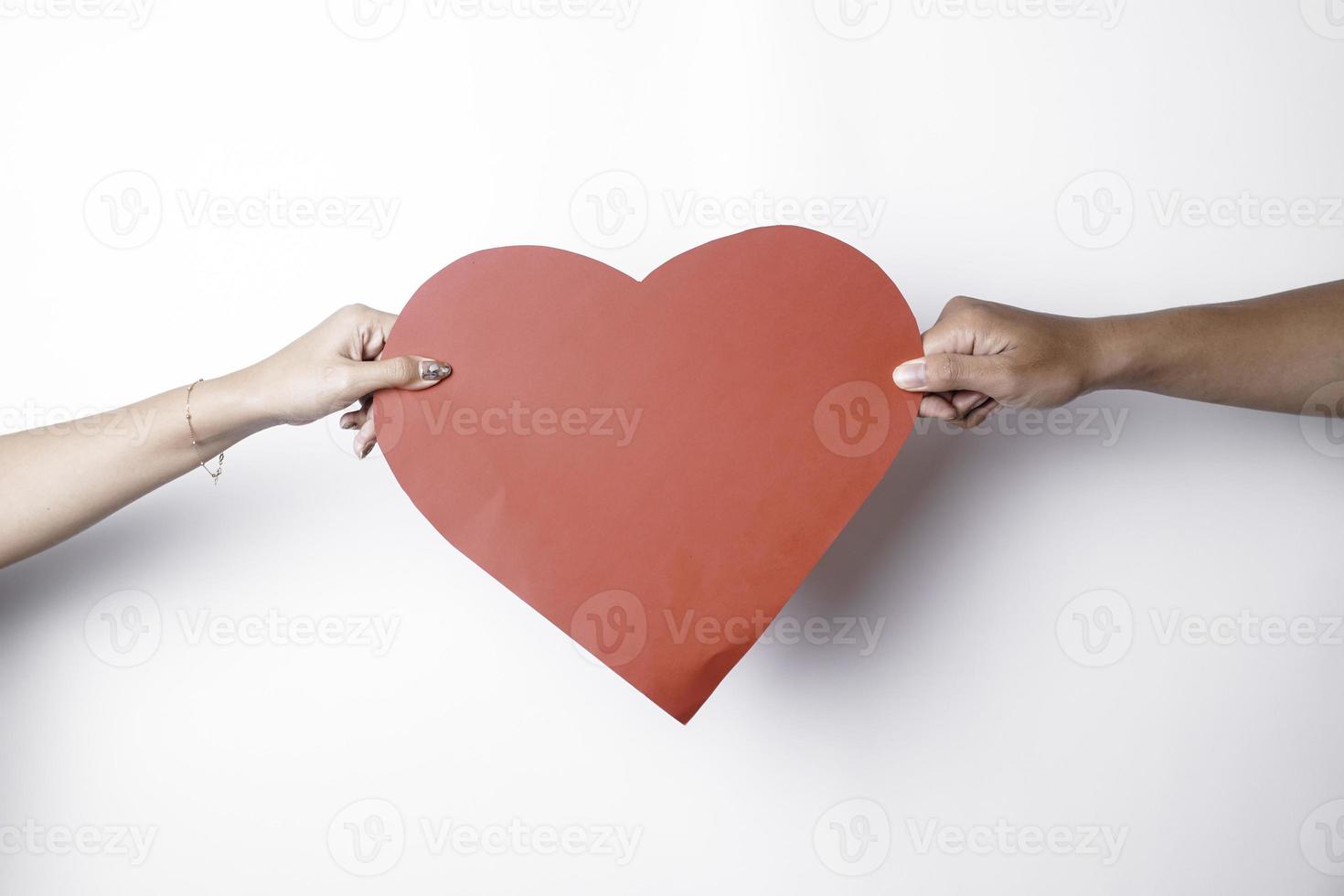 A photo of a red heart shape paper isolated on white background.