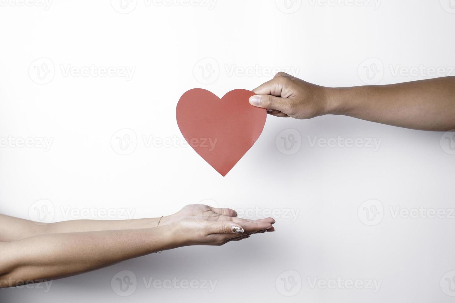 A photo of a red heart shape paper isolated on white background.