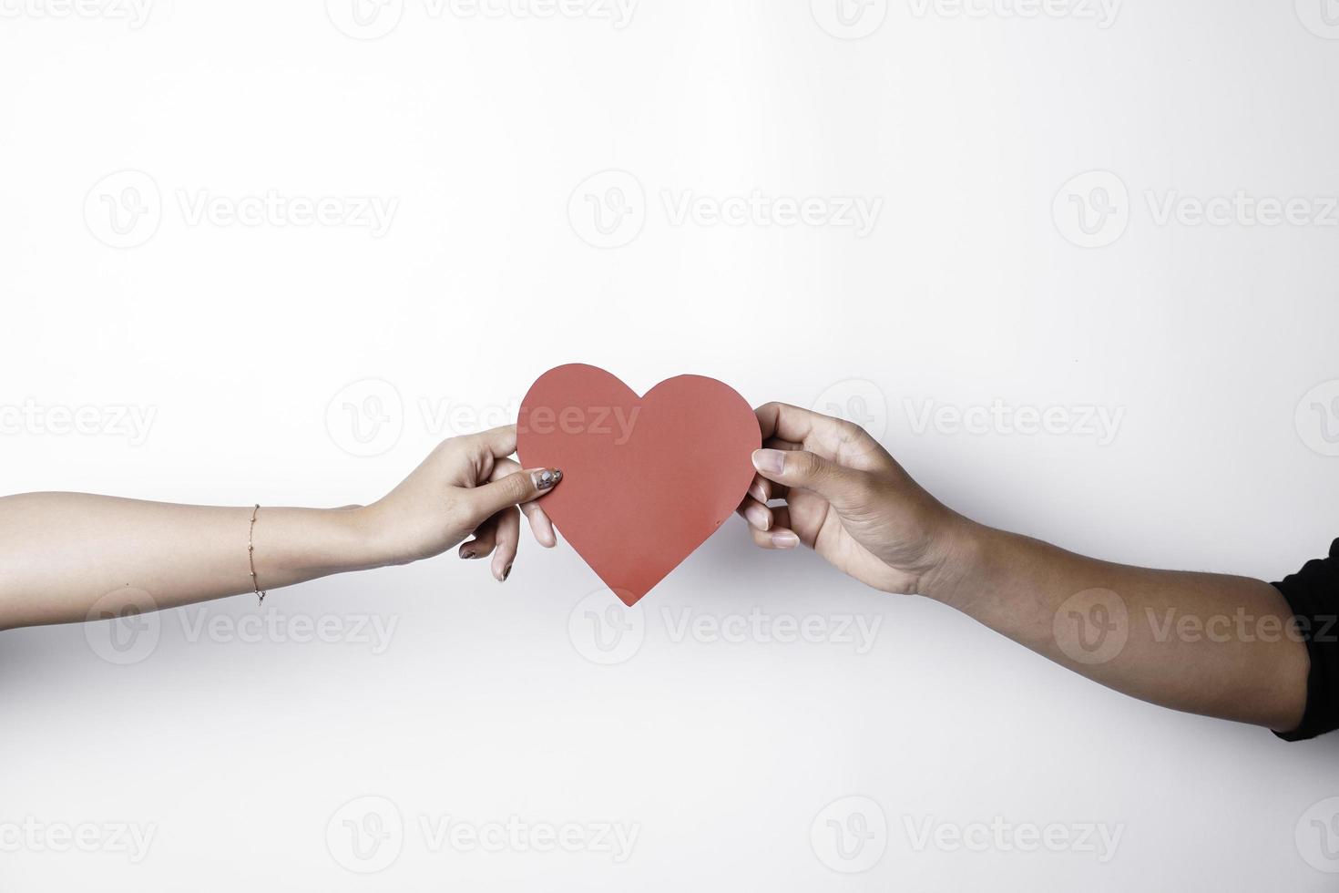 A photo of a red heart shape paper isolated on white background.