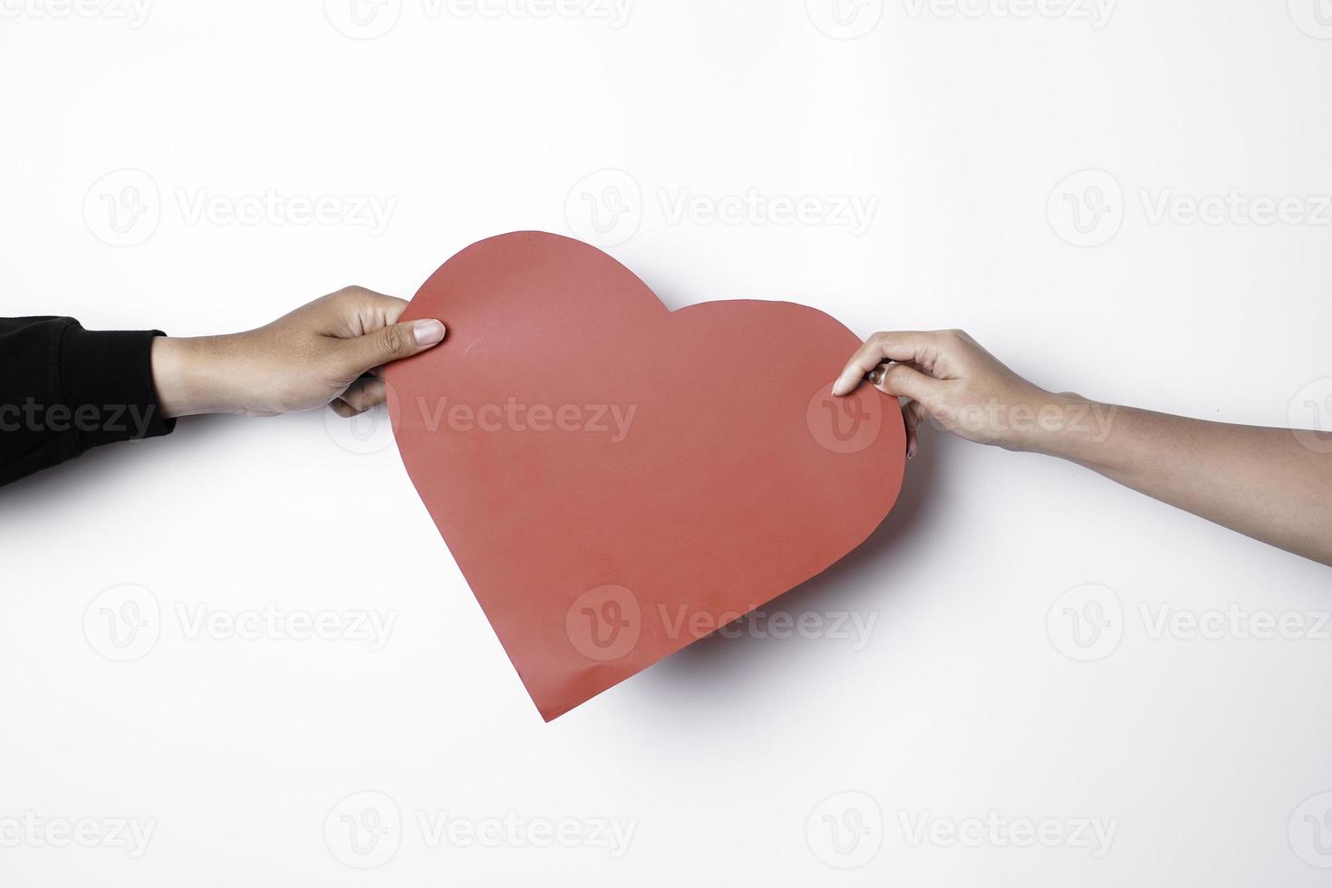 A photo of a red heart shape paper isolated on white background.