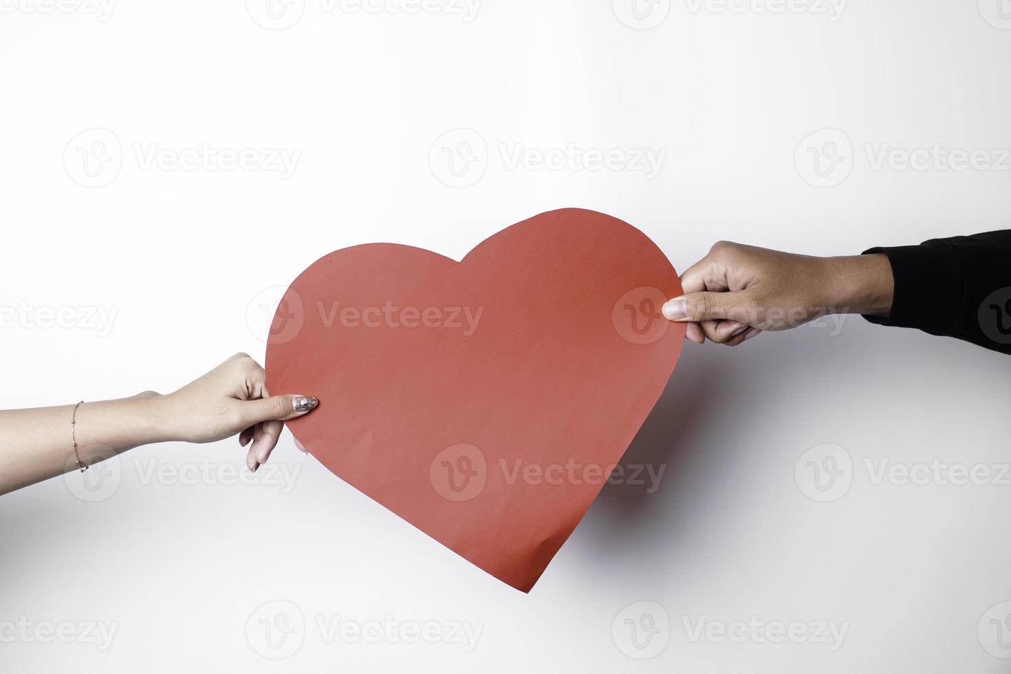 A photo of a red heart shape paper isolated on white background.