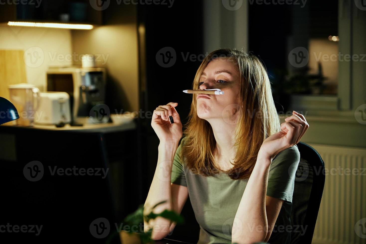 Tired woman works at home workplace photo