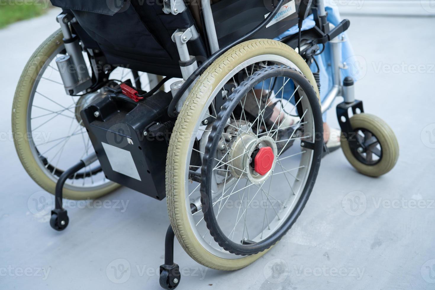 Asian senior or elderly old lady woman patient on electric wheelchair with battery at nursing hospital ward, healthy strong medical concept photo