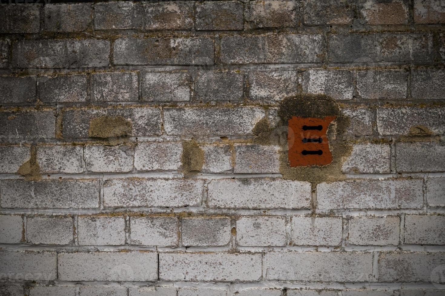 an old porous brick wall photo