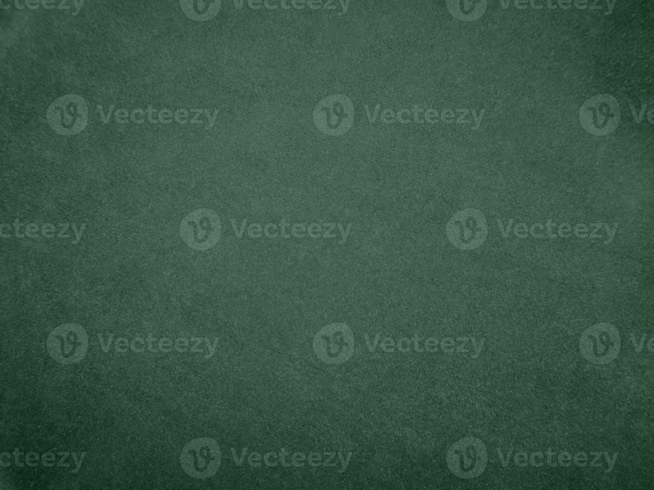 Olive green color velvet fabric texture used as background. light.Olive green fabric background of soft and smooth textile material. There is space for text. photo