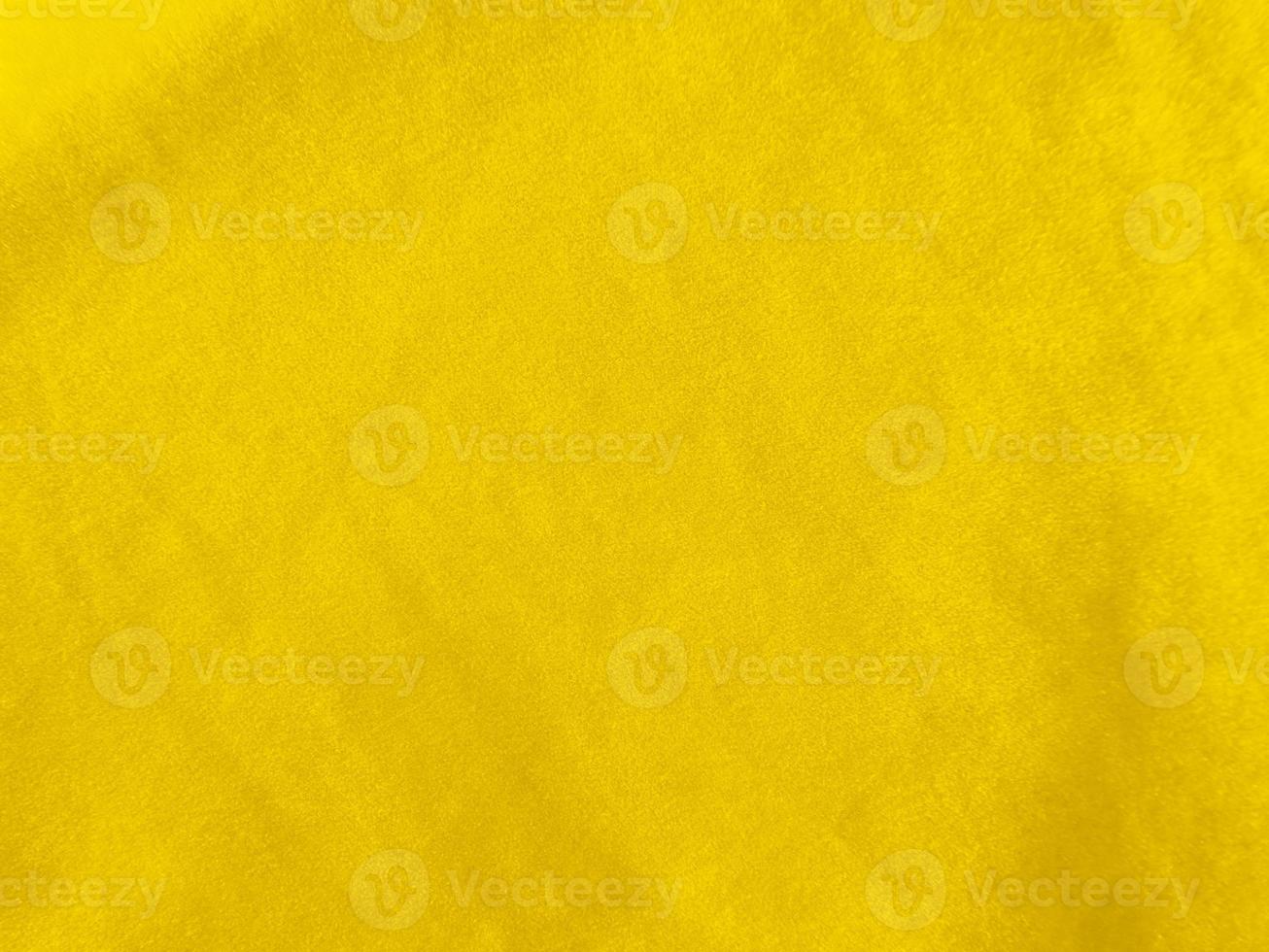 Yellow velvet fabric texture used as background. Empty yellow fabric