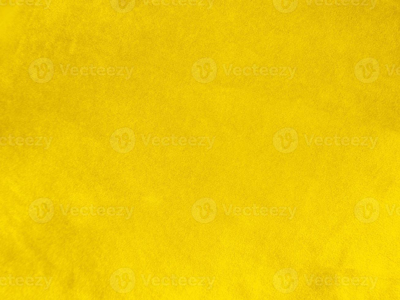 Yellow velvet fabric texture used as background. Empty yellow fabric