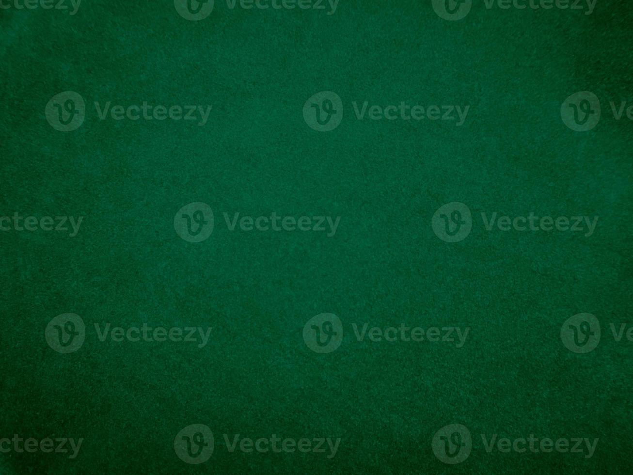 Dark green old velvet fabric texture used as background. Empty green fabric background of soft and smooth textile material. There is space for text.. photo