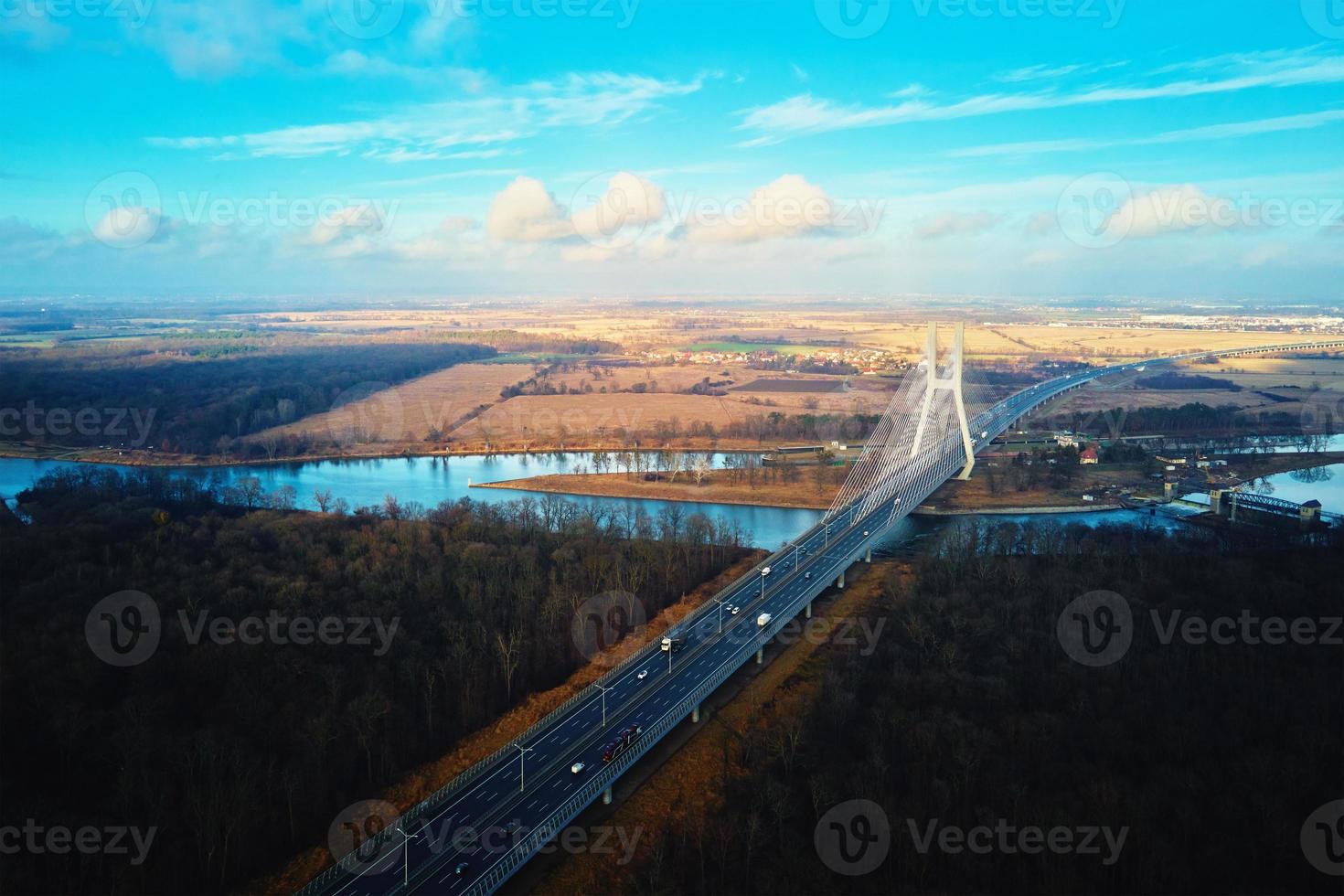 Large bridge over river with cars traffic photo