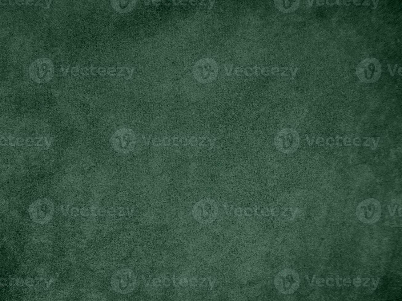 Olive green color velvet fabric texture used as background. light.Olive green fabric background of soft and smooth textile material. There is space for text. photo