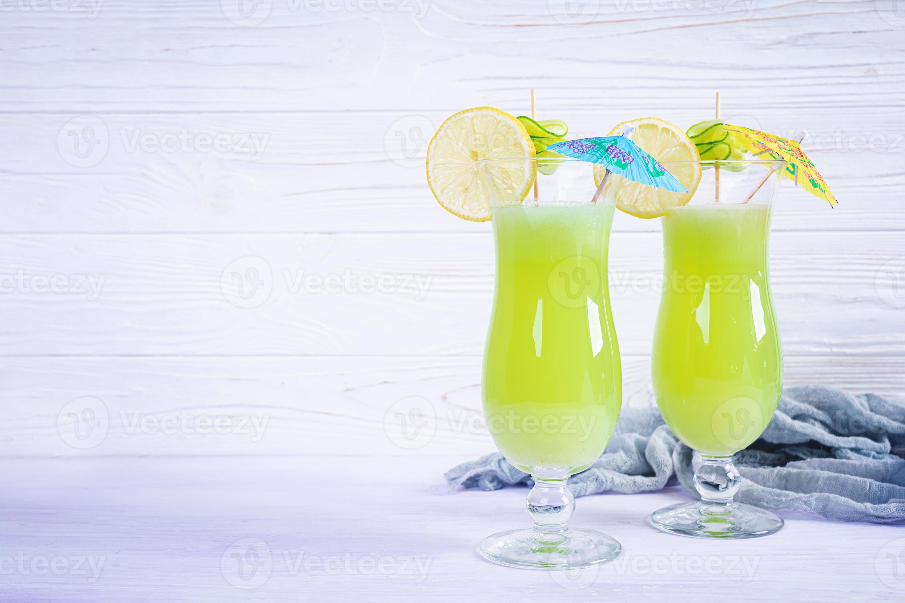 Glass of fresh cucumber juice. Cocktail with cucumber, ice and lemon