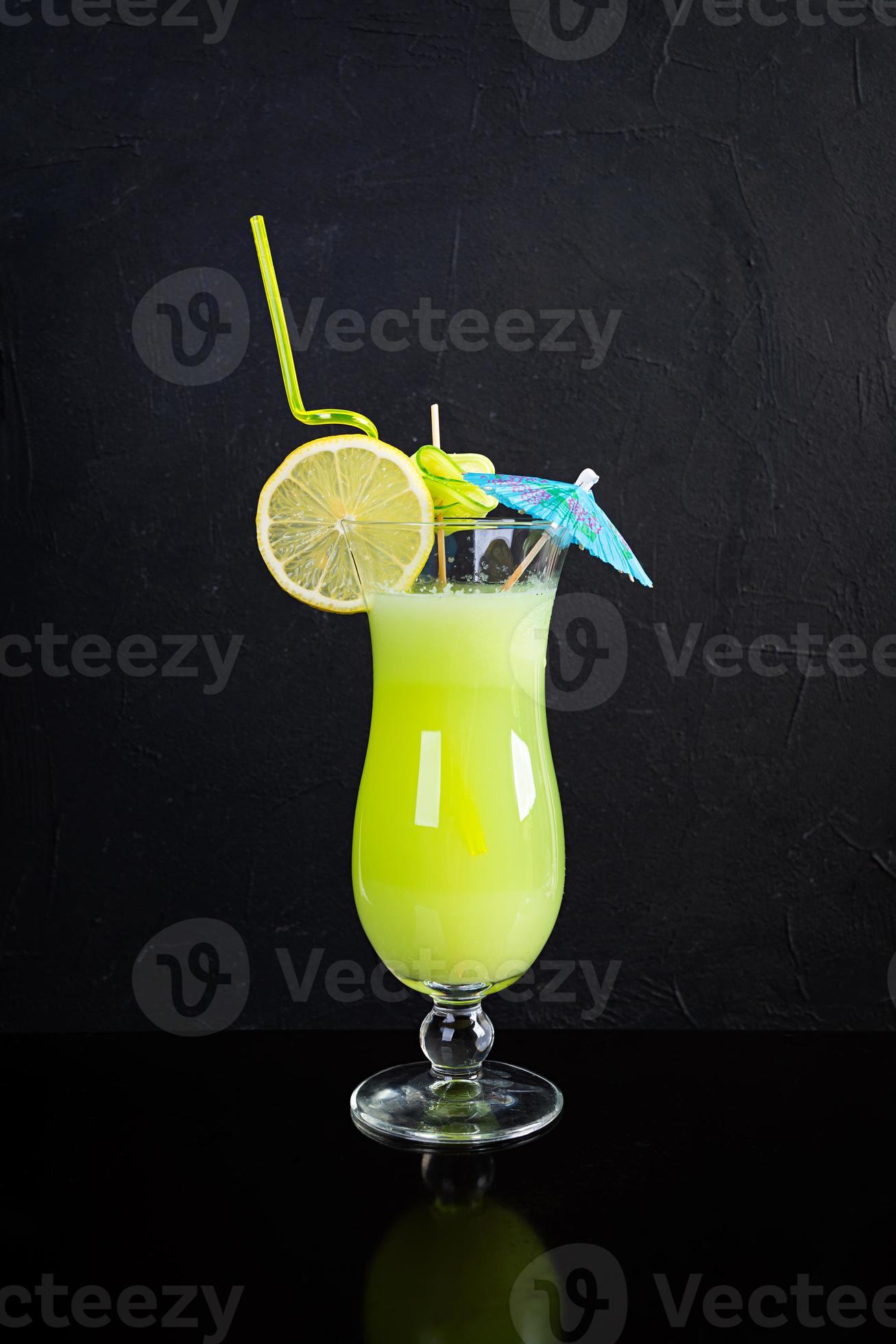 Glass of fresh cucumber juice. Cocktail with cucumber, ice and lemon